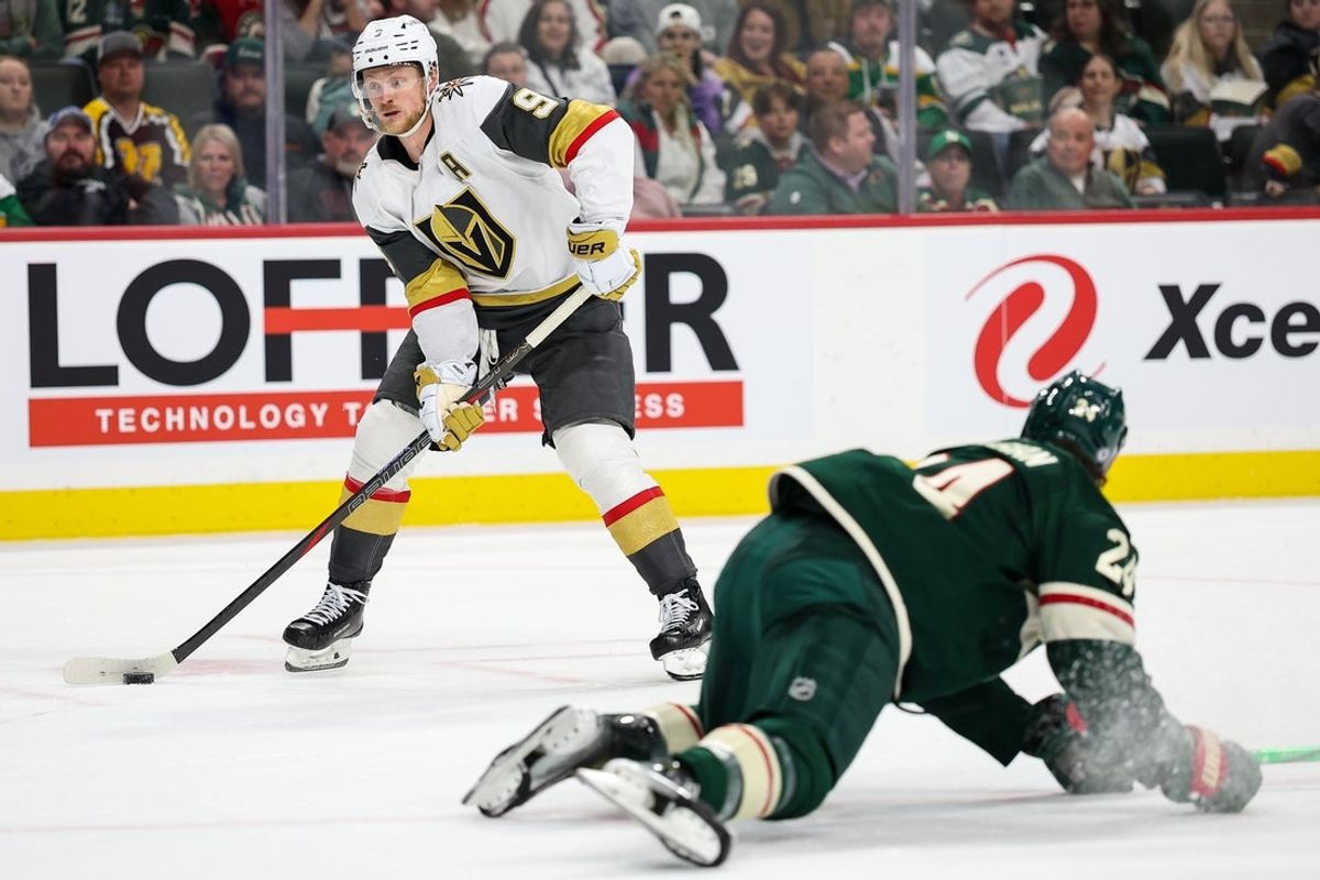 Mar 25, 2025; Saint Paul, Minnesota, USA; Vegas Golden Knights center Jack Eichel (9) skates with the puck as Minnesota Wild defenseman Zach Bogosian (24) defends during the third period at Xcel Energy Center. Mandatory Credit: Matt Krohn-Imagn Images