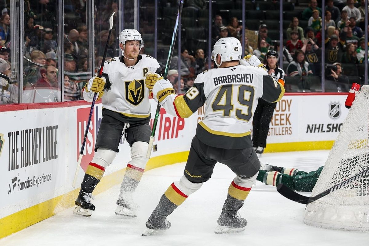 Mar 25, 2025; Saint Paul, Minnesota, USA; Vegas Golden Knights center Jack Eichel (9) celebrates his hat-trick with center Ivan Barbashev (49) during the third period against the Minnesota Wild at Xcel Energy Center. Mandatory Credit: Matt Krohn-Imagn Images