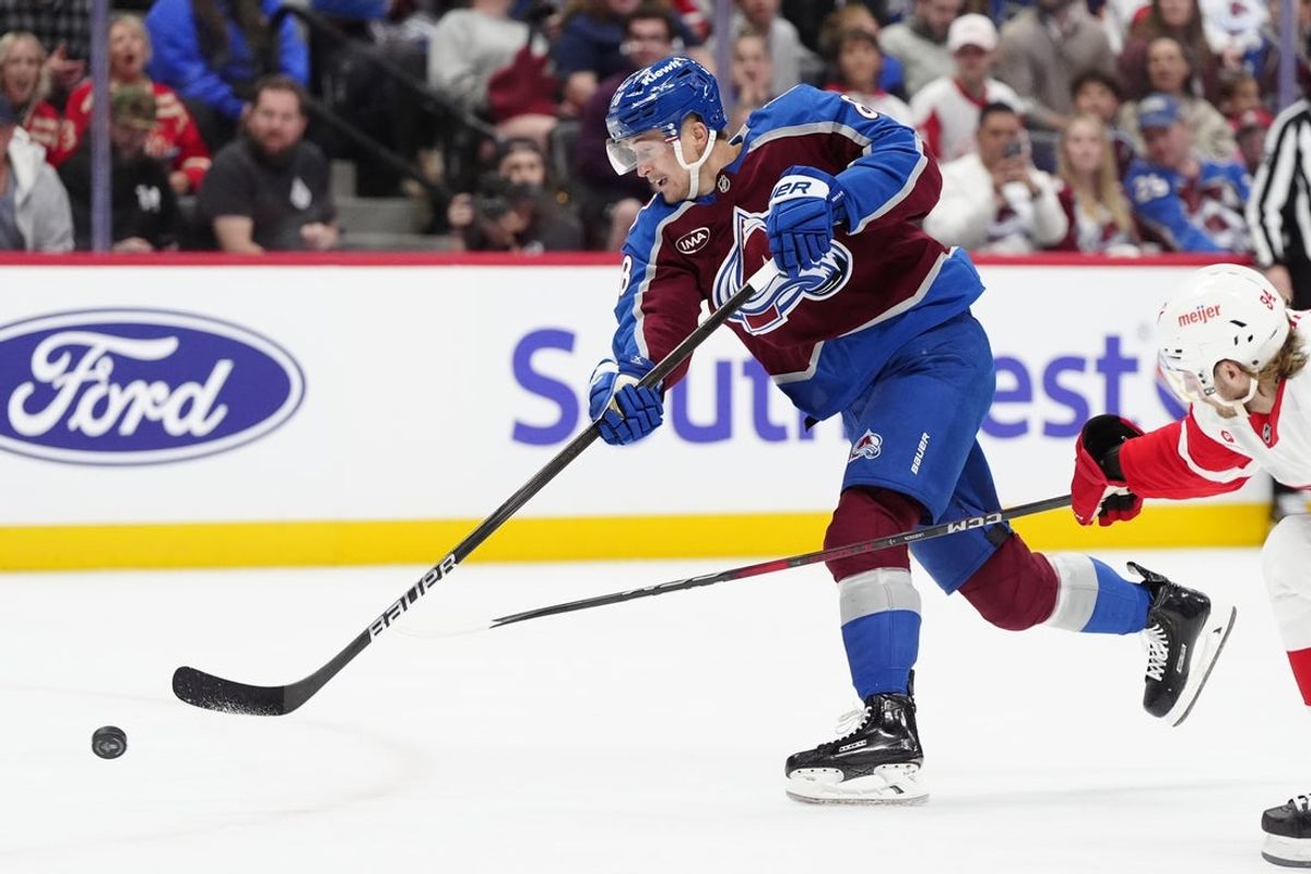 Mar 25, 2025; Denver, Colorado, USA; Colorado Avalanche center Martin Necas (88) takes a shot on goal in the second period against the Detroit Red Wings at Ball Arena. Mandatory Credit: Ron Chenoy-Imagn Images