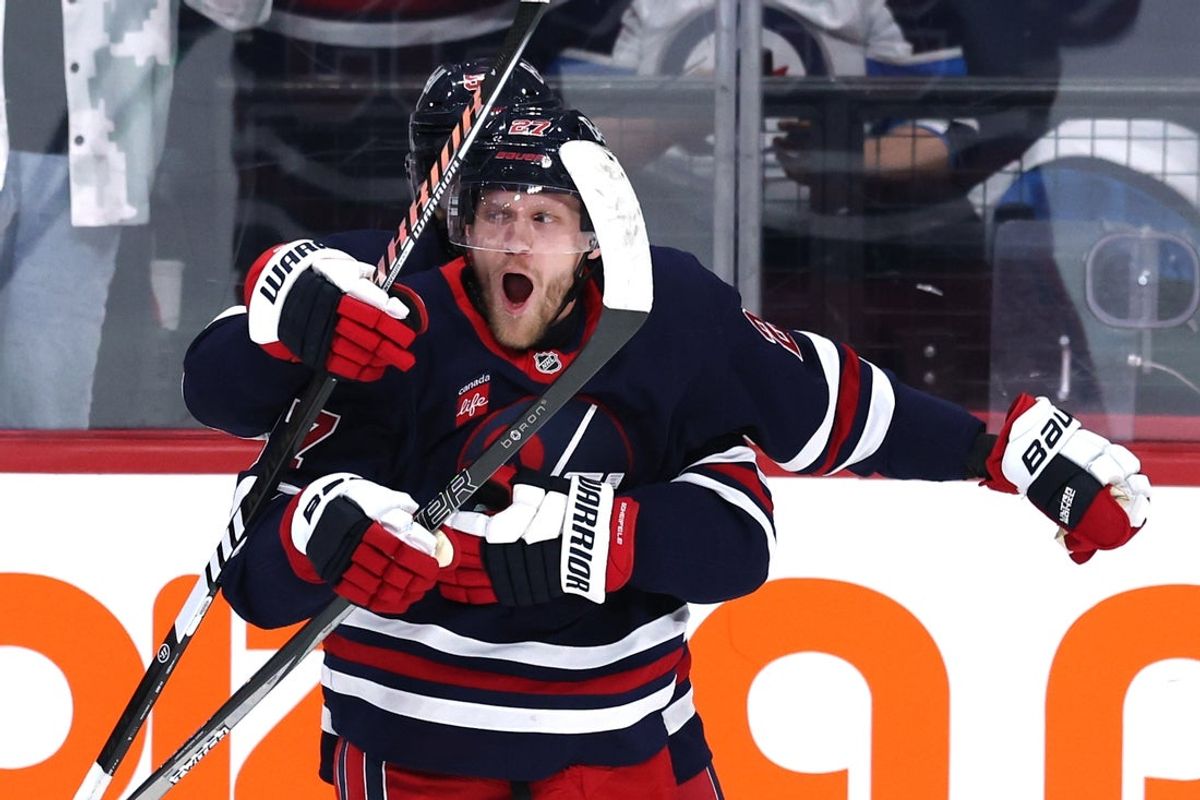 Mar 25, 2025; Winnipeg, Manitoba, CAN; Winnipeg Jets left wing Nikolaj Ehlers (27) celebrates his overtime goal against the Washington Capitals at Canada Life Centre. Mandatory Credit: James Carey Lauder-Imagn Images