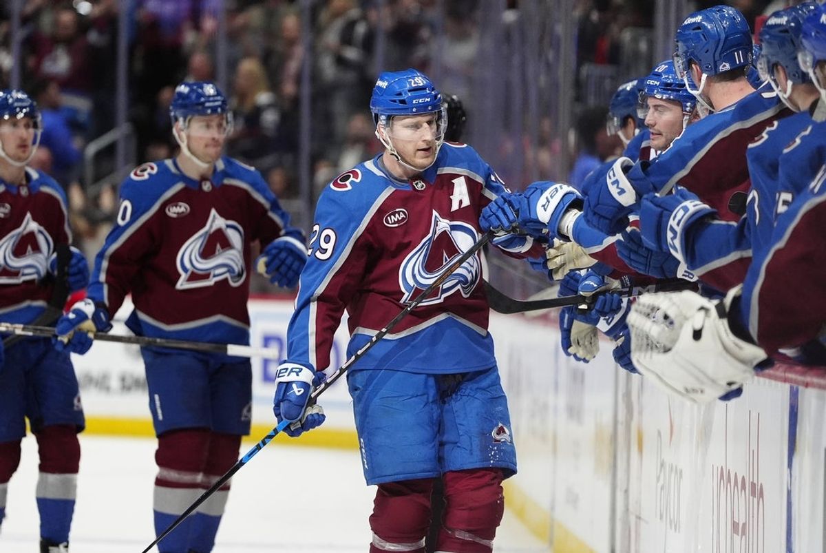 Mar 25, 2025; Denver, Colorado, USA; Colorado Avalanche center Nathan MacKinnon (29) celebrates his goal in the third period against the Detroit Red Wings at Ball Arena. Mandatory Credit: Ron Chenoy-Imagn Images