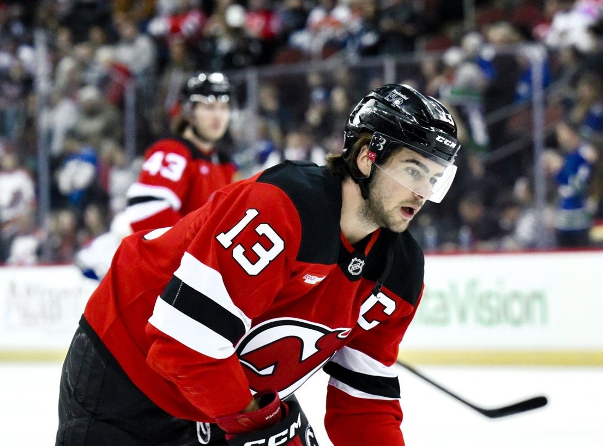 Mar 24, 2025; Newark, New Jersey, USA; New Jersey Devils center Nico Hischier (13) warms up before a game against the Vancouver Canucks at Prudential Center. Mandatory Credit: John Jones-Imagn Images