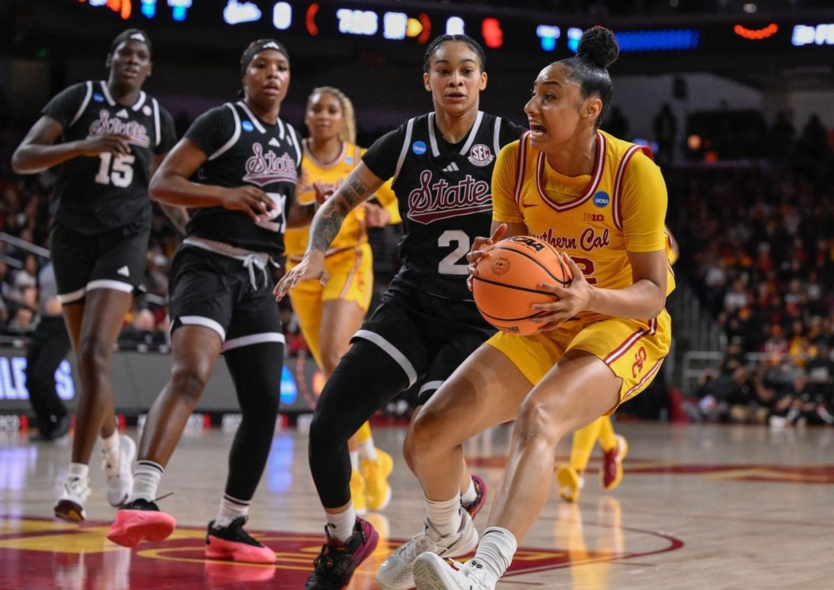 Mar 24, 2025; Los Angeles, California, USA; USC Trojans guard JuJu Watkins (12) drives to the basket past Mississippi State Bulldogs guard Jerkaila Jordan (2) during an NCAA Tournament second round game at Galen Center. Mandatory Credit: Robert Hanashiro-Imagn Images