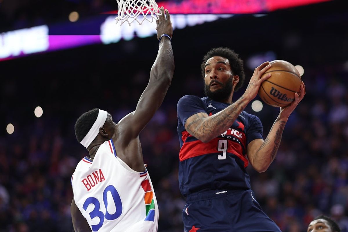 Mar 26, 2025; Philadelphia, Pennsylvania, USA; Washington Wizards forward Justin Champagnie (9) drives against Philadelphia 76ers center Adem Bona (30) during the second quarter at Wells Fargo Center. Mandatory Credit: Bill Streicher-Imagn Images