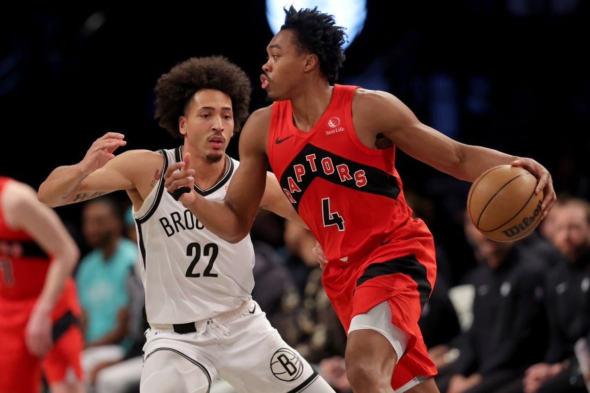 Mar 26, 2025; Brooklyn, New York, USA; Toronto Raptors forward Scottie Barnes (4) controls the ball against Brooklyn Nets forward Jalen Wilson (22) during the first quarter at Barclays Center. Mandatory Credit: Brad Penner-Imagn Images