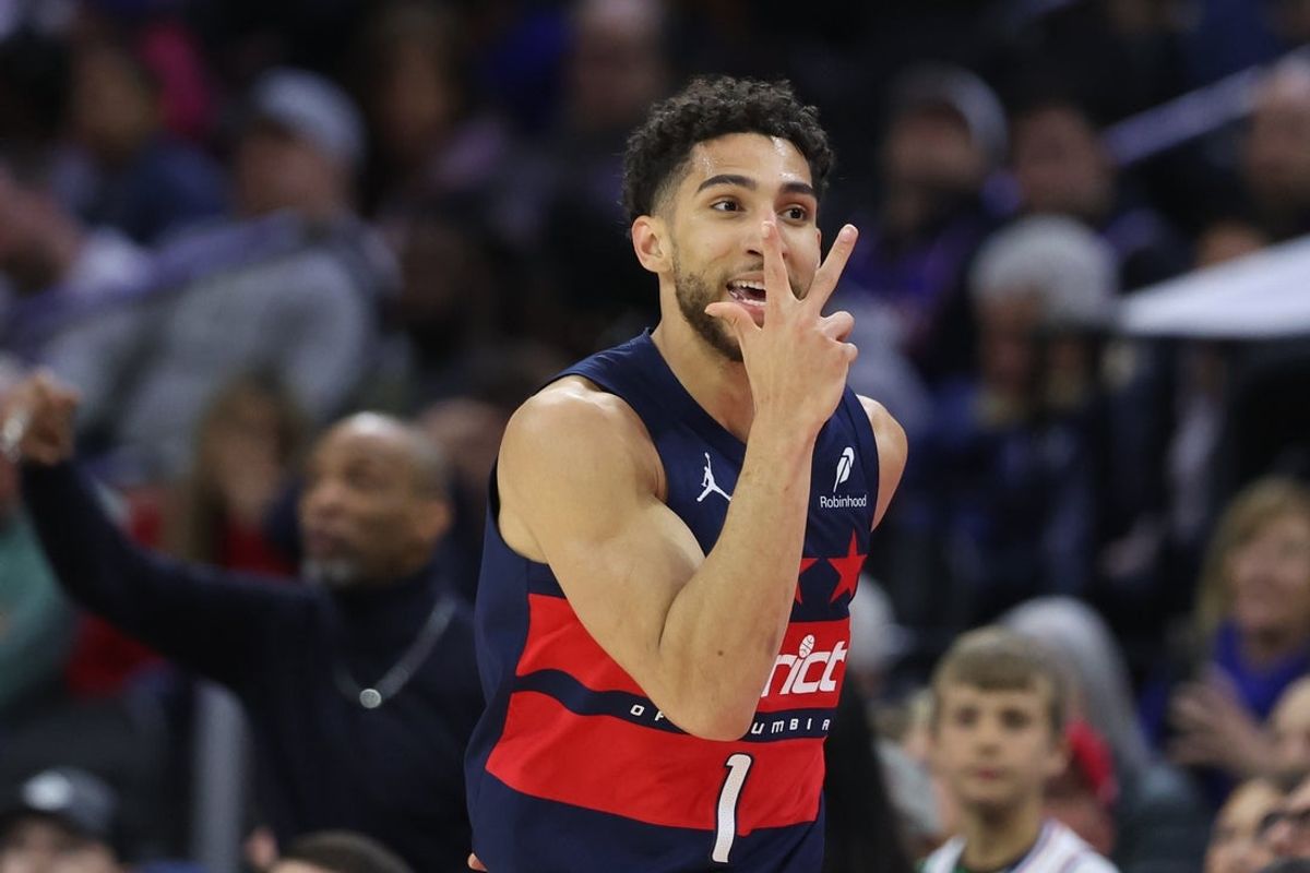 Mar 26, 2025; Philadelphia, Pennsylvania, USA; Washington Wizards guard Colby Jones (1) reacts after his three pointer against the Philadelphia 76ers during the third quarter at Wells Fargo Center. Mandatory Credit: Bill Streicher-Imagn Images