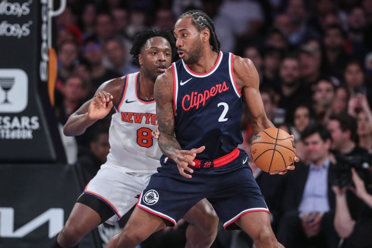 Mar 26, 2025; New York, New York, USA;  LA Clippers forward Kawhi Leonard (2) looks to post up against New York Knicks forward OG Anunoby (8) in the fourth quarter at Madison Square Garden. Mandatory Credit: Wendell Cruz-Imagn Images