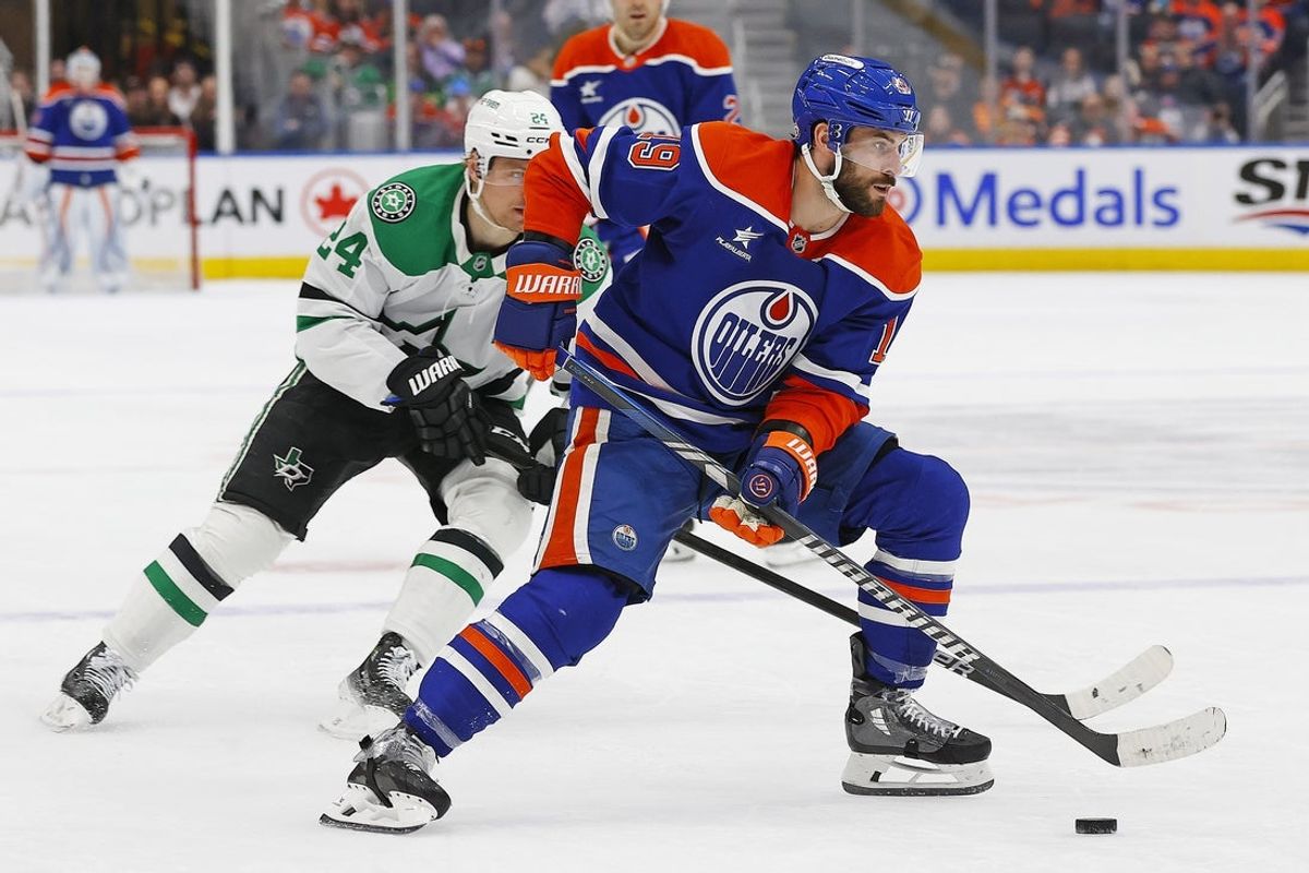 Mar 26, 2025; Edmonton, Alberta, CAN; Edmonton Oilers forward Adam Henrique (19) looks to make a pass in front of Dallas Stars forward Roope Hintz (24) during the third period at Rogers Place. Mandatory Credit: Perry Nelson-Imagn Images
