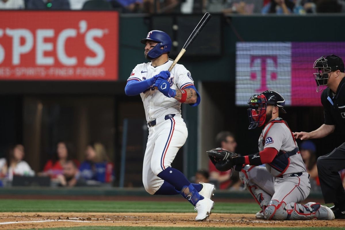 Mar 27, 2025; Arlington, Texas, USA; Texas Rangers outfielder Kevin Pillar (1) singles in a run during the second inning against the Boston Red Sox at Globe Life Field. Mandatory Credit: Tim Heitman-Imagn Images