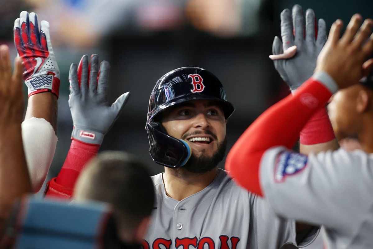 Mar 27, 2025; Arlington, Texas, USA; Boston Red Sox outfielder Wilyer Abreu (52) is congratulated by his teammates after hitting a solo home run during the fifth inning against the Texas Rangers at Globe Life Field. Mandatory Credit: Tim Heitman-Imagn Images