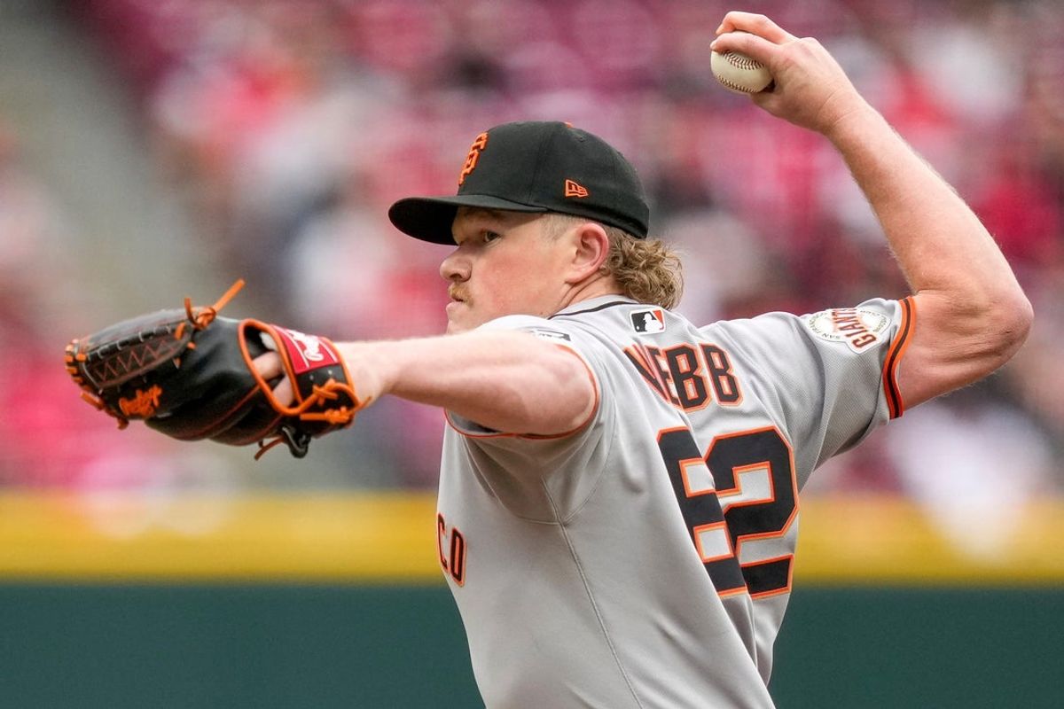 San Francisco Giants pitcher Logan Webb (62) throws a pitch in the first inning of the MLB Opening Day game between the Cincinnati Reds and the San Francisco Giants at Great American Ball Park in downtown Cincinnati on Thursday, March 27, 2025. The Reds led 3-0 after three innings.