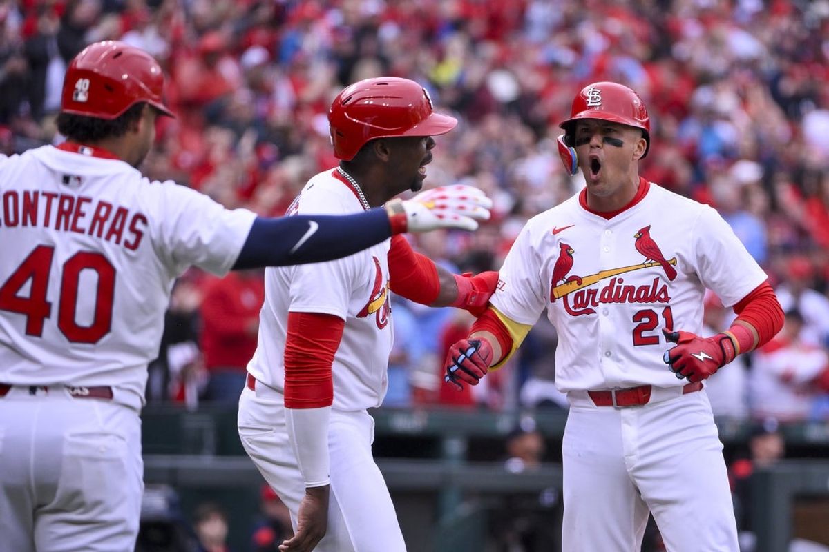 Mar 27, 2025; St. Louis, Missouri, USA;  St. Louis Cardinals left fielder Lars Nootbaar (21) celebrates with right fielder Jordan Walker (18) and first baseman Willson Contreras (40) after hitting a two run home run against the Minnesota Twins during the second inning at Busch Stadium. Mandatory Credit: Jeff Curry-Imagn Images