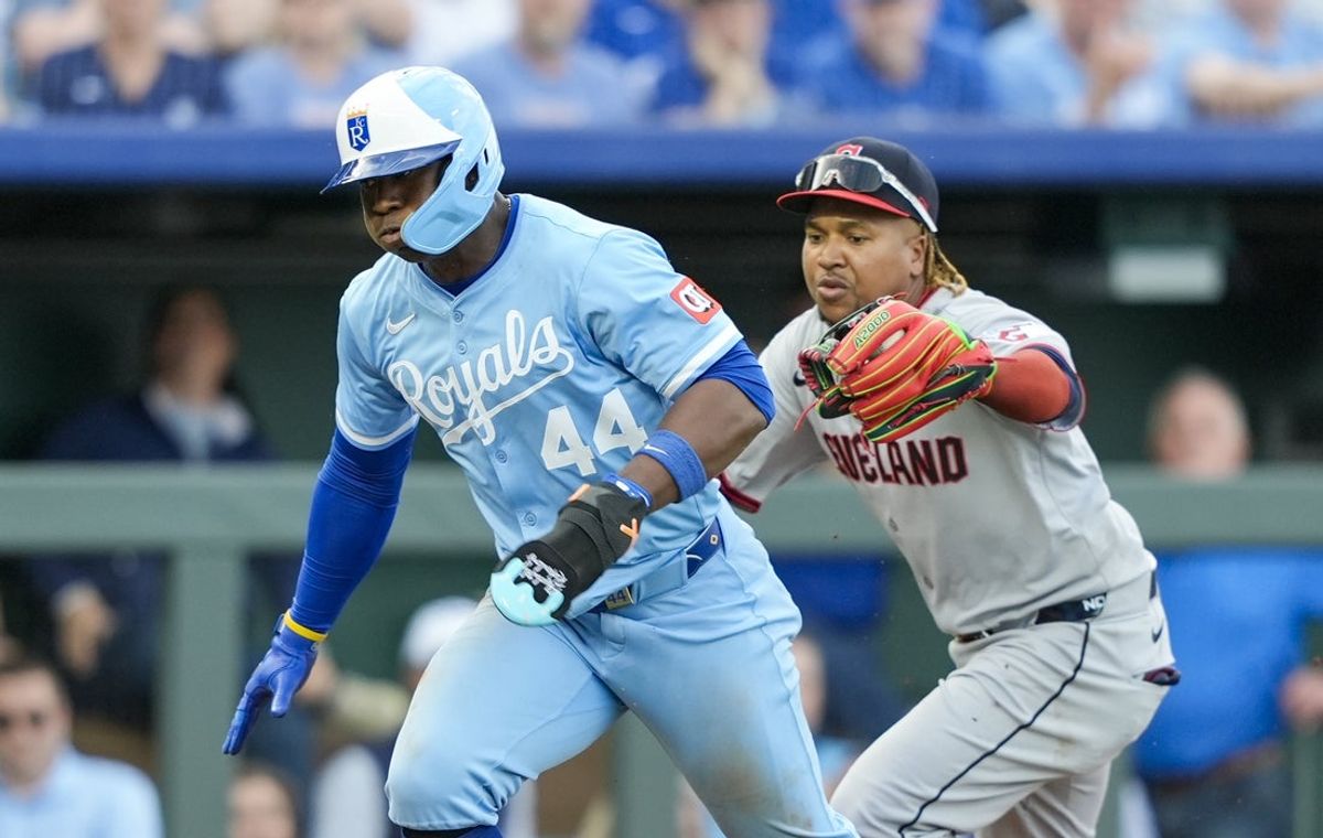 Mar 27, 2025; Kansas City, Missouri, USA; Kansas City Royals outfielder Dairon Blanco (44) is caught in a rundown by Cleveland Guardians third baseman Jose Ramirez (11) during the eighth inning at Kauffman Stadium. Mandatory Credit: Jay Biggerstaff-Imagn Images