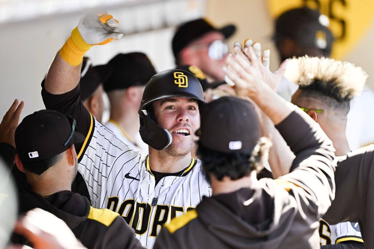 Mar 27, 2025; San Diego, California, USA; San Diego Padres outfielder Gavin Sheets (30) is congratulated after hitting a solo home run during the seventh inning at Petco Park. Mandatory Credit: Denis Poroy-Imagn Images