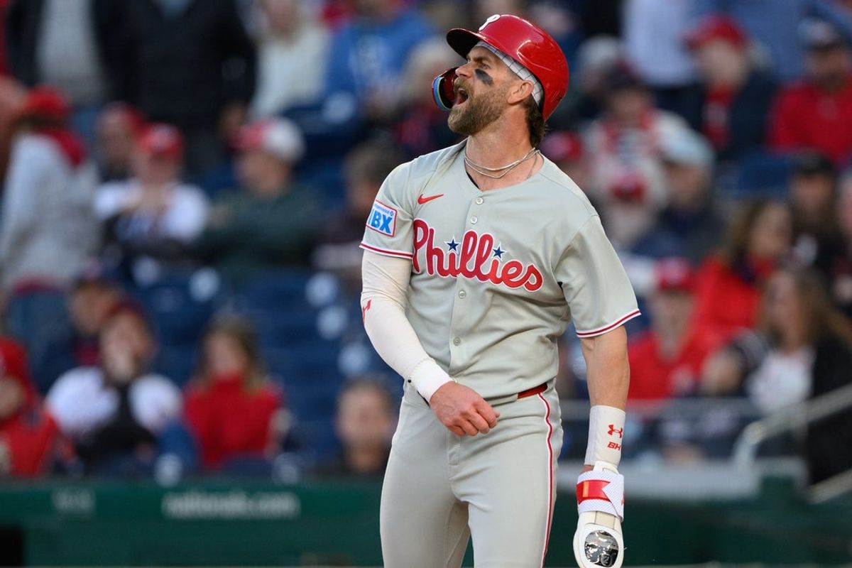Mar 27, 2025; Washington, District of Columbia, USA; Philadelphia Phillies first base Bryce Harper (3) reacts after scoring a run during the tenth inning against the Washington Nationals at Nationals Park. Mandatory Credit: Reggie Hildred-Imagn Images