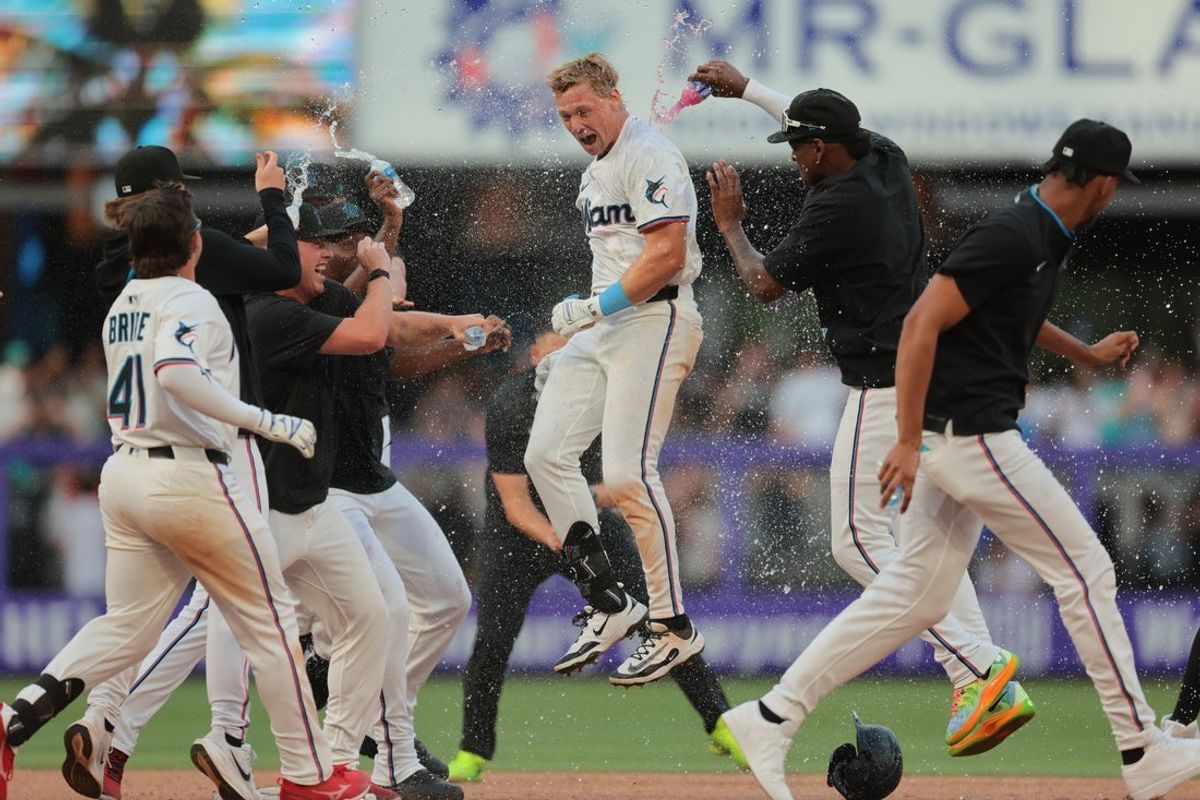 Mar 27, 2025; Miami, Florida, USA; Miami Marlins left fielder Kyle Stowers (28) celebrates with teammates after hitting a walk-off single against the Pittsburgh Pirates during the ninth inning at loanDepot Park. Mandatory Credit: Sam Navarro-Imagn Images