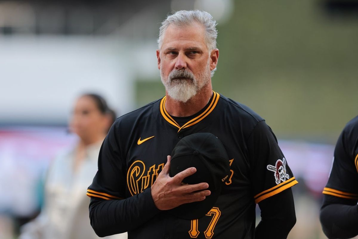 Mar 27, 2025; Miami, Florida, USA; Pittsburgh Pirates manager Derek Shelton (17) listen to the national anthem before the game against the Miami Marlins at loanDepot Park. Mandatory Credit: Sam Navarro-Imagn Images