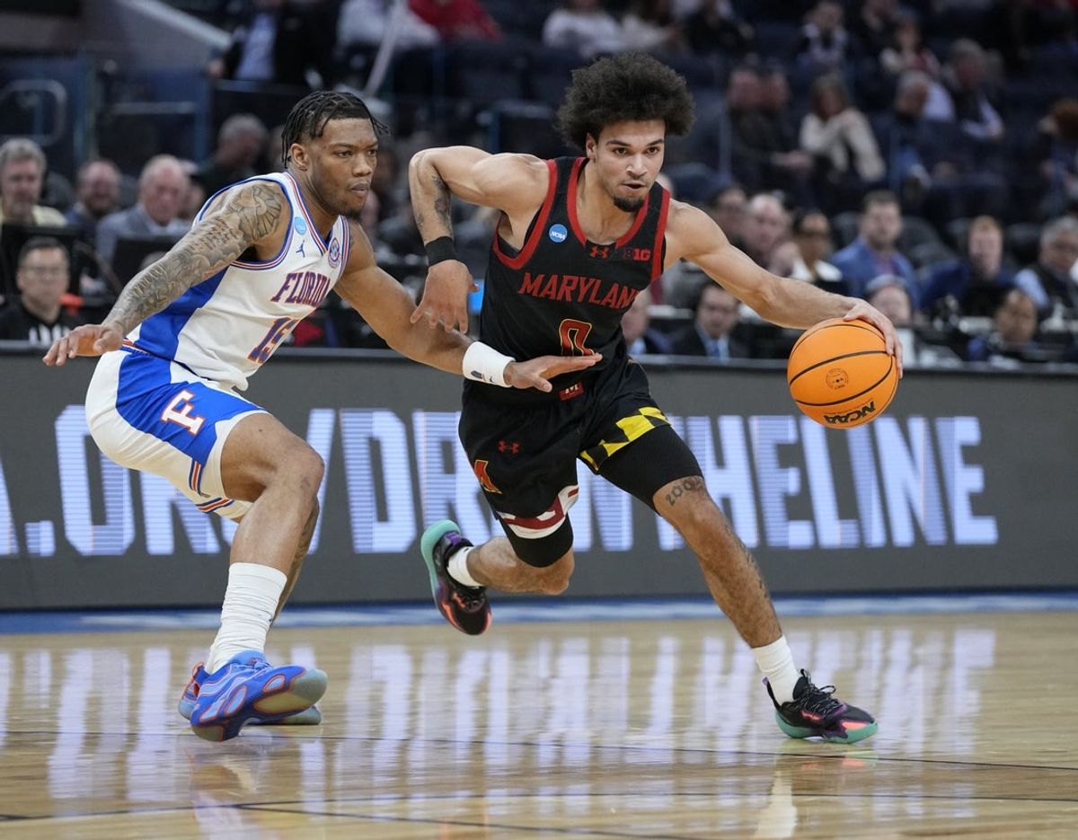 Mar 27, 2025; San Francisco, CA, USA; Maryland Terrapins guard Ja'Kobi Gillespie (0) drives to the hoop past Florida Gators guard Alijah Martin (15) during the first half during a West Regional semifinal of the 2025 NCAA tournament at Chase Center. Mandatory Credit: Kyle Terada-Imagn Images
