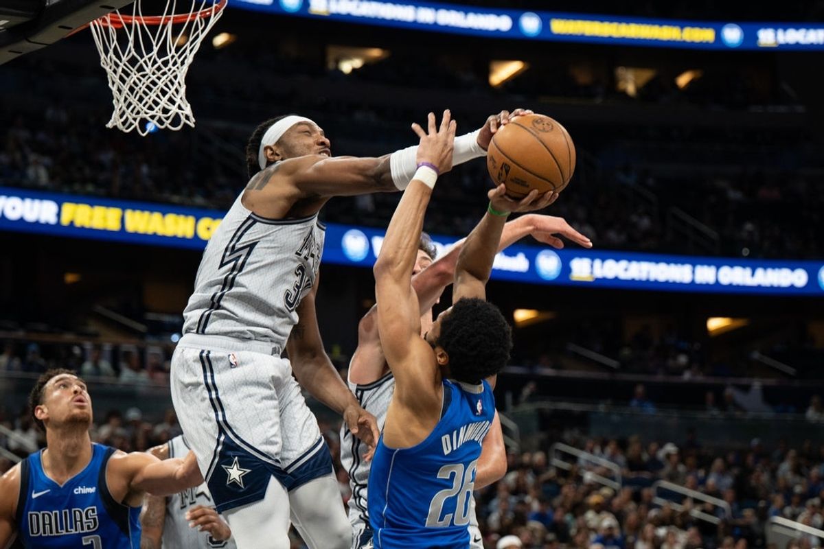 Mar 27, 2025; Orlando, Florida, USA; Orlando Magic forward Wendell Carter Jr. blocks the shot of Dallas Mavericks guard Spencer Dinwiddie (26) in the second quarter at Kia Center. Mandatory Credit: Jeremy Reper-Imagn Images