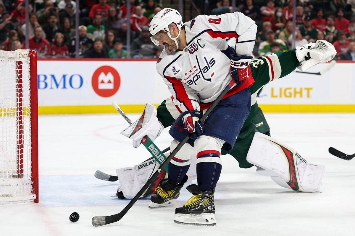 Mar 27, 2025; Saint Paul, Minnesota, USA; Washington Capitals left wing Alex Ovechkin (8) shoots the puck against Minnesota Wild goaltender Filip Gustavsson (32) during the first period at Xcel Energy Center. Mandatory Credit: Matt Krohn-Imagn Images