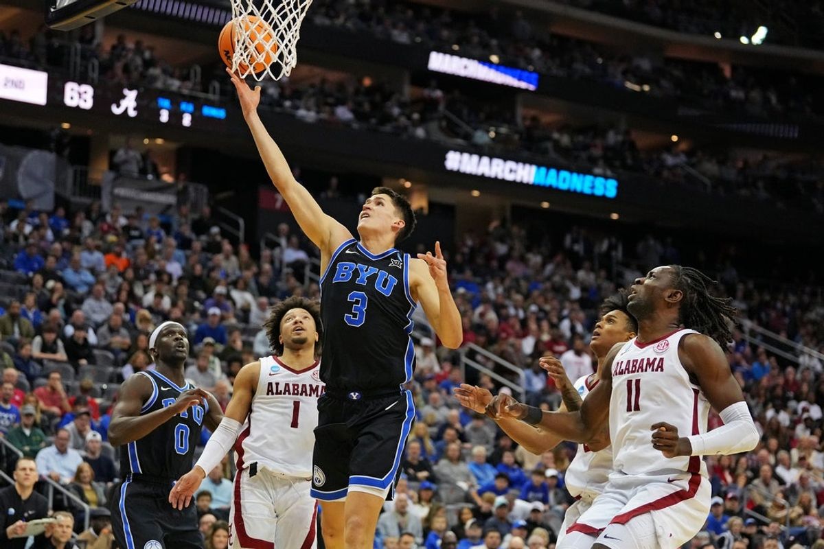 Mar 27, 2025; Newark, NJ, USA; Brigham Young Cougars guard Egor Demin (3) drives to the basket against Alabama Crimson Tide guard Mark Sears (1) during the second half during an East Regional semifinal of the 2025 NCAA tournament at Prudential Center. Mandatory Credit: Robert Deutsch-Imagn Images