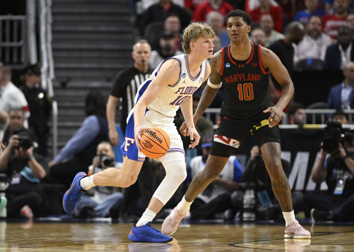 Mar 27, 2025; San Francisco, CA, USA; Florida Gators forward Thomas Haugh (10) dribbles downcourt past Maryland Terrapins forward Julian Reese (10) during the second half during a West Regional semifinal of the 2025 NCAA tournament at Chase Center. Mandatory Credit: Eakin Howard-Imagn Images