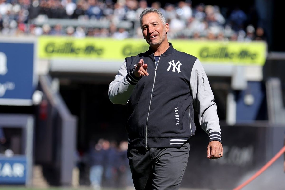 Mar 27, 2025; Bronx, New York, USA; New York Yankees former pitcher Andy Pettitte reacts after throwing out the ceremonial first pitch before an opening day game against the Milwaukee Brewers at Yankee Stadium. Mandatory Credit: Brad Penner-Imagn Images
