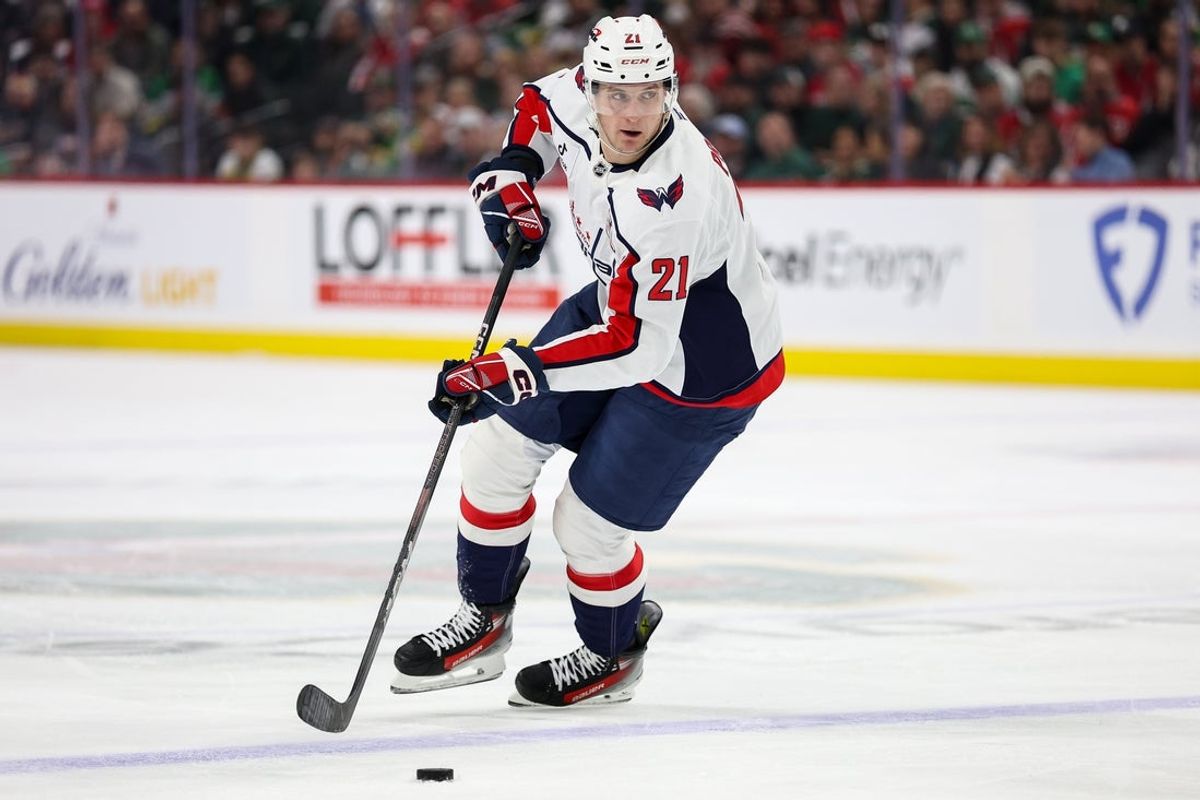 Mar 27, 2025; Saint Paul, Minnesota, USA; Washington Capitals center Aliaksei Protas (21) skates with the puck against the Minnesota Wild during the second period at Xcel Energy Center. Mandatory Credit: Matt Krohn-Imagn Images