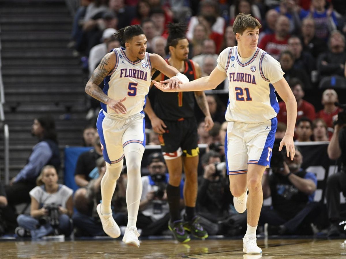 Mar 27, 2025; San Francisco, CA, USA; Florida Gators guard Will Richard (5) and forward Alex Condon (21) high-five during the second half against the Maryland Terrapins during a West Regional semifinal of the 2025 NCAA tournament at Chase Center. Mandatory Credit: Eakin Howard-Imagn Images