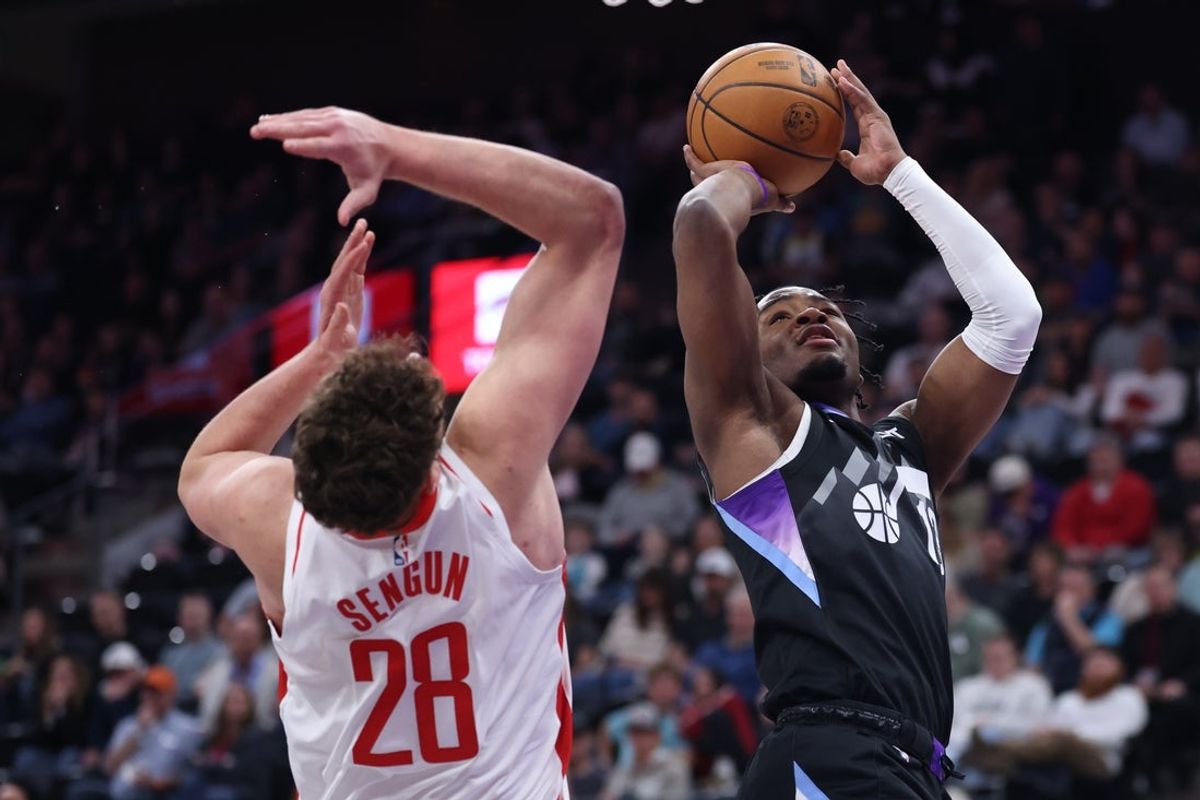 Mar 27, 2025; Salt Lake City, Utah, USA; Utah Jazz guard Isaiah Collier (13) goes to the basket against Houston Rockets center Alperen Sengun (28) during the first half at Delta Center. Mandatory Credit: Rob Gray-Imagn Images