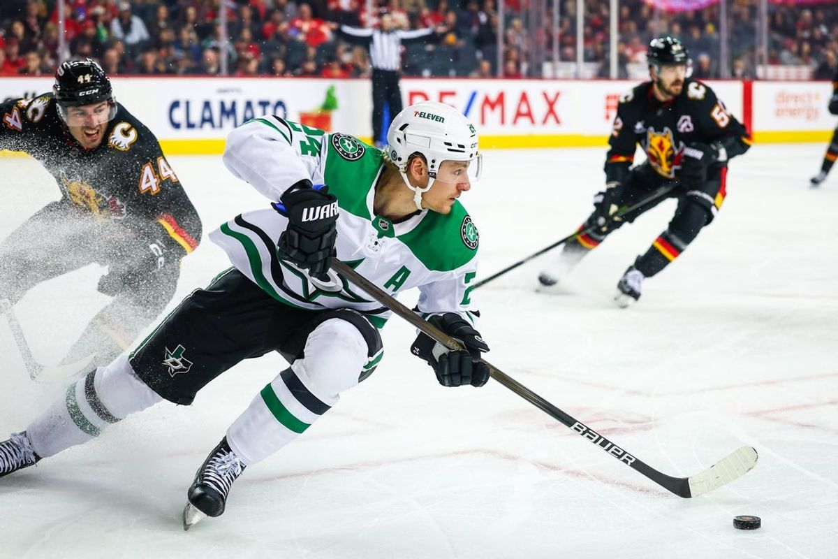 Mar 27, 2025; Calgary, Alberta, CAN; Dallas Stars center Roope Hintz (24) skates with the puck against the Calgary Flames during the first period at Scotiabank Saddledome. Mandatory Credit: Sergei Belski-Imagn Images