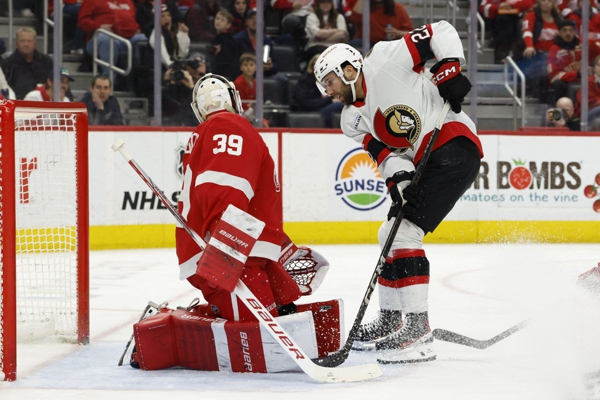 Mar 27, 2025; Detroit, Michigan, USA;  Ottawa Senators right wing Michael Amadio (22) scores against Detroit Red Wings goaltender Cam Talbot (39) in the third period at Little Caesars Arena. Mandatory Credit: Rick Osentoski-Imagn Images