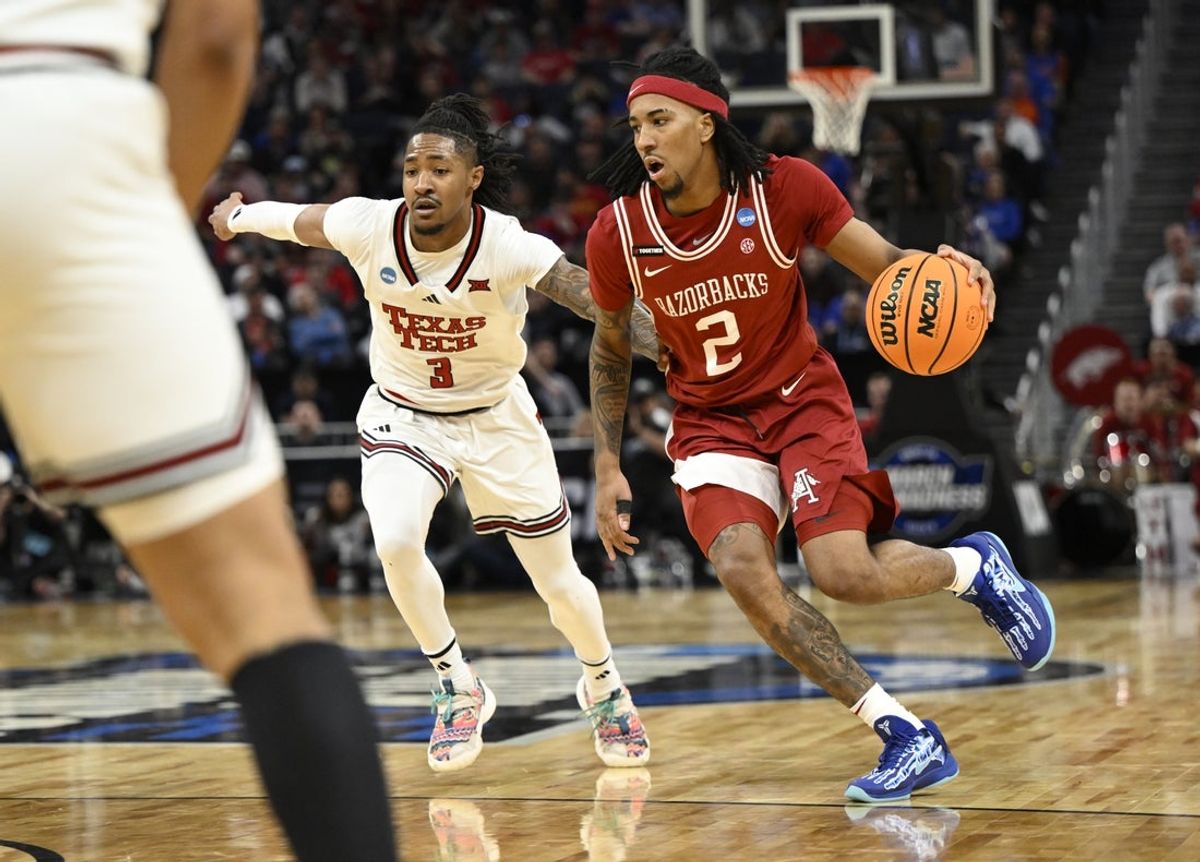Mar 27, 2025; San Francisco, CA, USA; Arkansas Razorbacks guard Boogie Fland (2) drives to the hoop past Texas Tech Red Raiders guard Elijah Hawkins (3) during the first half during a West Regional semifinal of the 2025 NCAA tournament at Chase Center. Mandatory Credit: Eakin Howard-Imagn Images