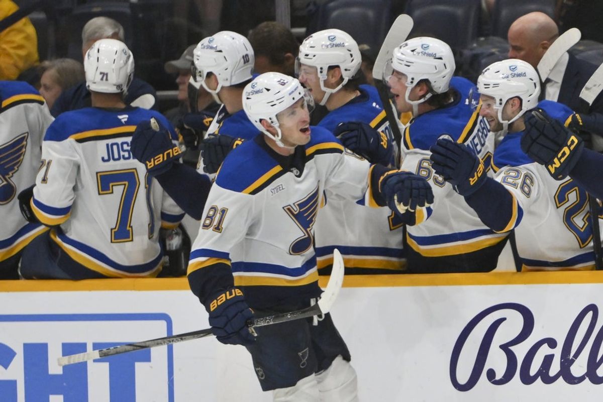 Mar 27, 2025; Nashville, Tennessee, USA;  St. Louis Blues center Dylan Holloway (81) against the Nashville Predators during the third period at Bridgestone Arena. Mandatory Credit: Steve Roberts-Imagn Images