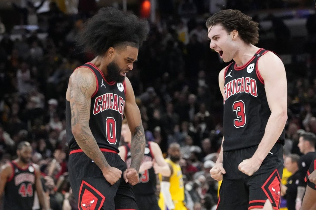 Mar 27, 2025; Chicago, Illinois, USA; Chicago Bulls guard Coby White (0) celebrates his three point basket against the Los Angeles Lakers with guard Josh Giddey (3) during the second half at United Center. Mandatory Credit: David Banks-Imagn Images