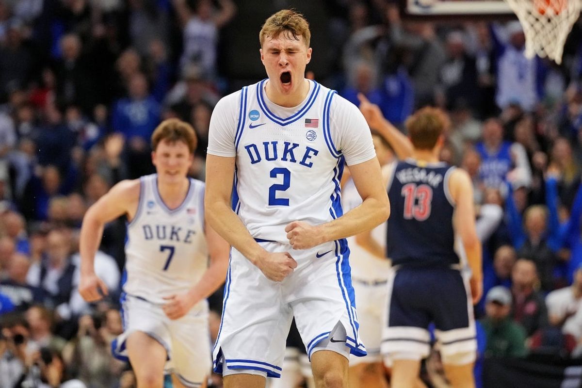 Mar 27, 2025; Newark, NJ, USA; Duke Blue Devils forward Cooper Flagg (2) reacts after making a last second shot to end the first half against the Arizona Wildcats during an East Regional semifinal of the 2025 NCAA tournament at Prudential Center. Mandatory Credit: Robert Deutsch-Imagn Images