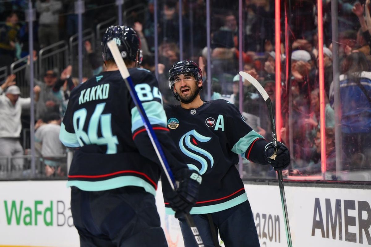 Mar 27, 2025; Seattle, Washington, USA; Seattle Kraken center Matty Beniers (10) and right wing Kaapo Kakko (84) celebrates after Beniers scored a goal against the Edmonton Oilers during the second period at Climate Pledge Arena. Mandatory Credit: Steven Bisig-Imagn Images