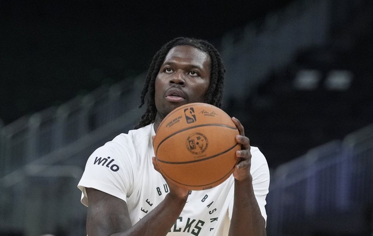 Mar 28, 2025; Milwaukee, Wisconsin, USA; Milwaukee Bucks forward Chris Livingston (7) puts up a shot during pregame warmups before a game against New York Knicks at Fiserv Forum. Mandatory Credit: Michael McLoone-Imagn Images