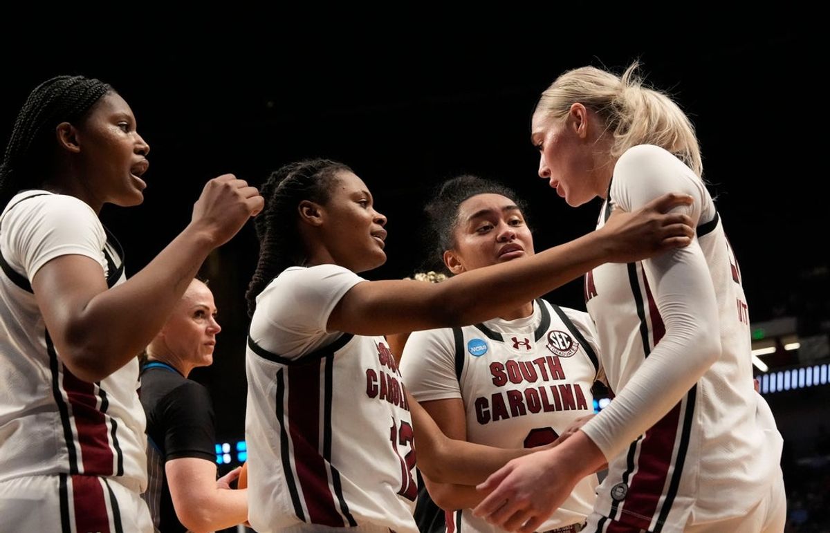 Mar 28, 2025; Birmingham, AL, USA; South Carolina players encourage South Carolina Gamecocks forward Chloe Kitts (21) as she prepares to go to the free throw line at Legacy Arena in the Sweet 16. South Carolina advanced to the Elite 8 wtih a 71-67 victory. Mandatory Credit: Gary Cosby Jr.-Tuscaloosa News