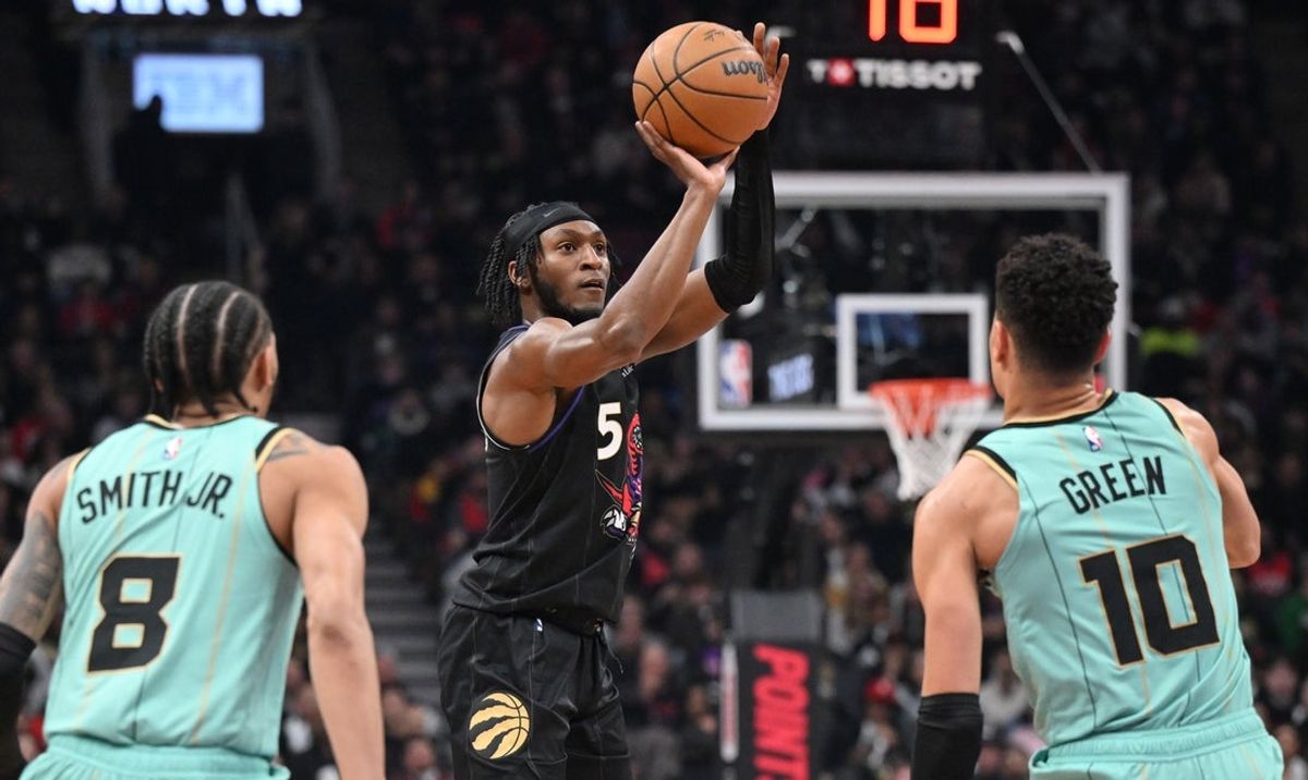 Mar 28, 2025; Toronto, Ontario, CAN;  Toronto Raptors guard Immanuel Quickley (5) shoots the ball over Charlotte Hornets guards Josh Green (10) and Nick Smith Jr. (8) in the first half at Scotiabank Arena. Mandatory Credit: Dan Hamilton-Imagn Images