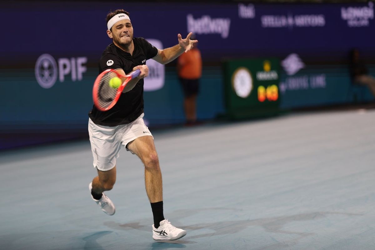 Mar 28, 2025; Miami, FL, USA; Taylor Fritz (USA) reaches for a forehand against Jakub Mensik (CZE)(not pictured) in a men's singles semifinal on day eleven of the Miami Open at Hard Rock Stadium. Mandatory Credit: Geoff Burke-Imagn Images