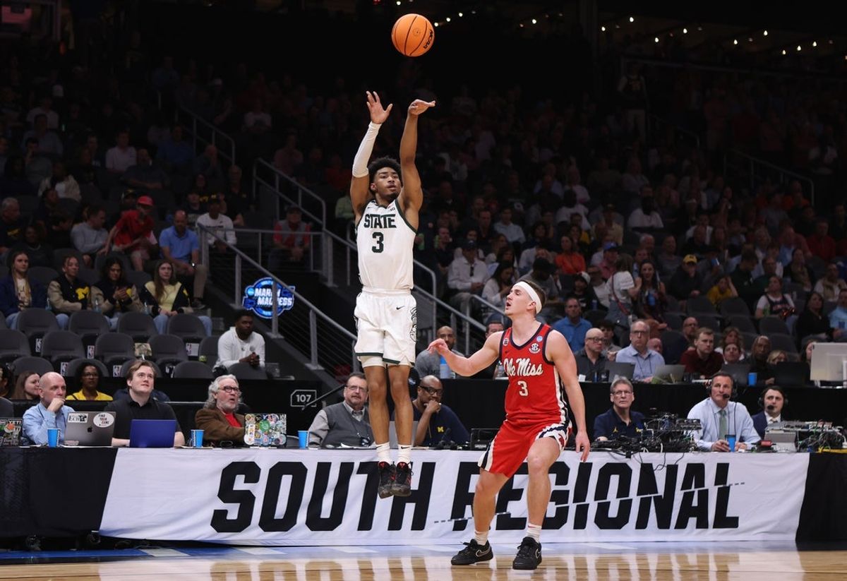 Mar 28, 2025; Atlanta, GA, USA; Michigan State Spartans guard Jaden Akins (3) shoots against Mississippi Rebels guard Sean Pedulla (3) in the second half of a South Regional semifinal of the 2025 NCAA tournament at State Farm Arena. Mandatory Credit: Brett Davis-Imagn Images