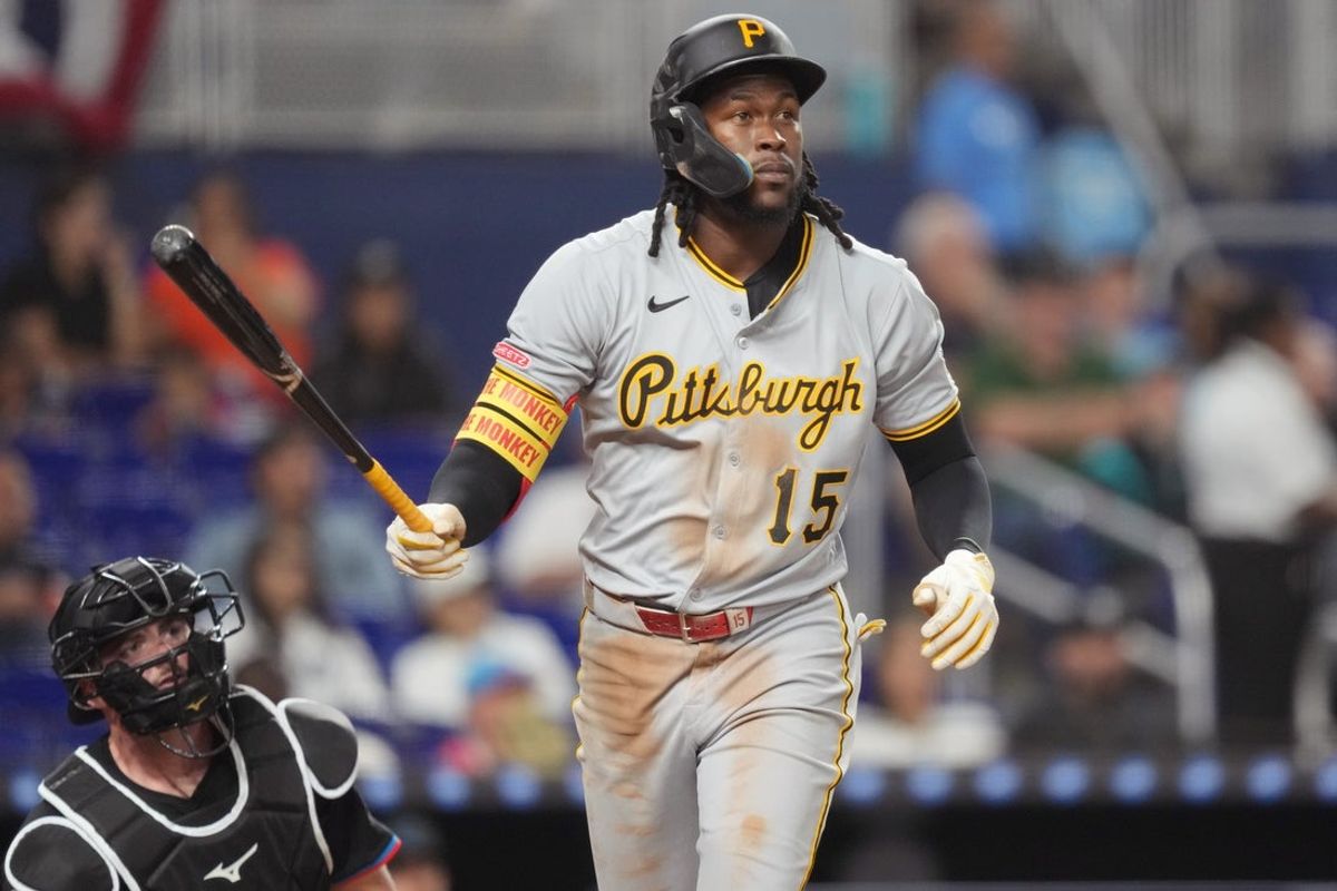 Mar 28, 2025; Miami, Florida, USA;  Pittsburgh Pirates center fielder Oneil Cruz (15) watches his two-run home run in the fifth inning leave the park as Miami Marlins catcher Liam Hicks (34) looks on at loanDepot Park. Mandatory Credit: Jim Rassol-Imagn Images