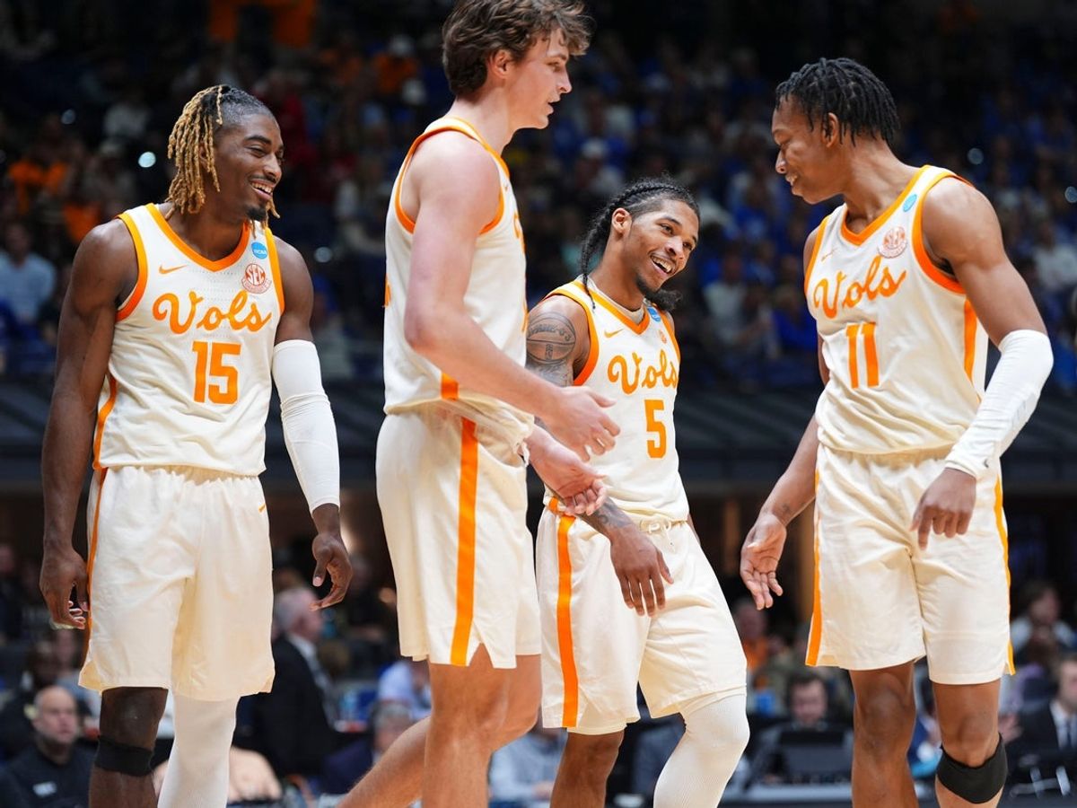 Tennessee's Jahmai Mashack (15), Cade Phillips (12), Zakai Zeigler (5), and Jordan Gainey (11) celebrating during the Sweet 16 game against Kentucky in the NCAA college basketball tournament on Friday, March 28, 2025, in Indianapolis, IN.