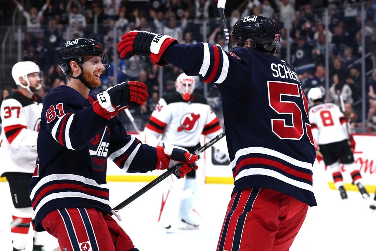 Mar 28, 2025; Winnipeg, Manitoba, CAN; Winnipeg Jets center Mark Scheifele (55) celebrates his goal against the New Jersey Devils with Winnipeg Jets left wing Kyle Connor (81) in the second period at Canada Life Centre. Mandatory Credit: James Carey Lauder-Imagn Images