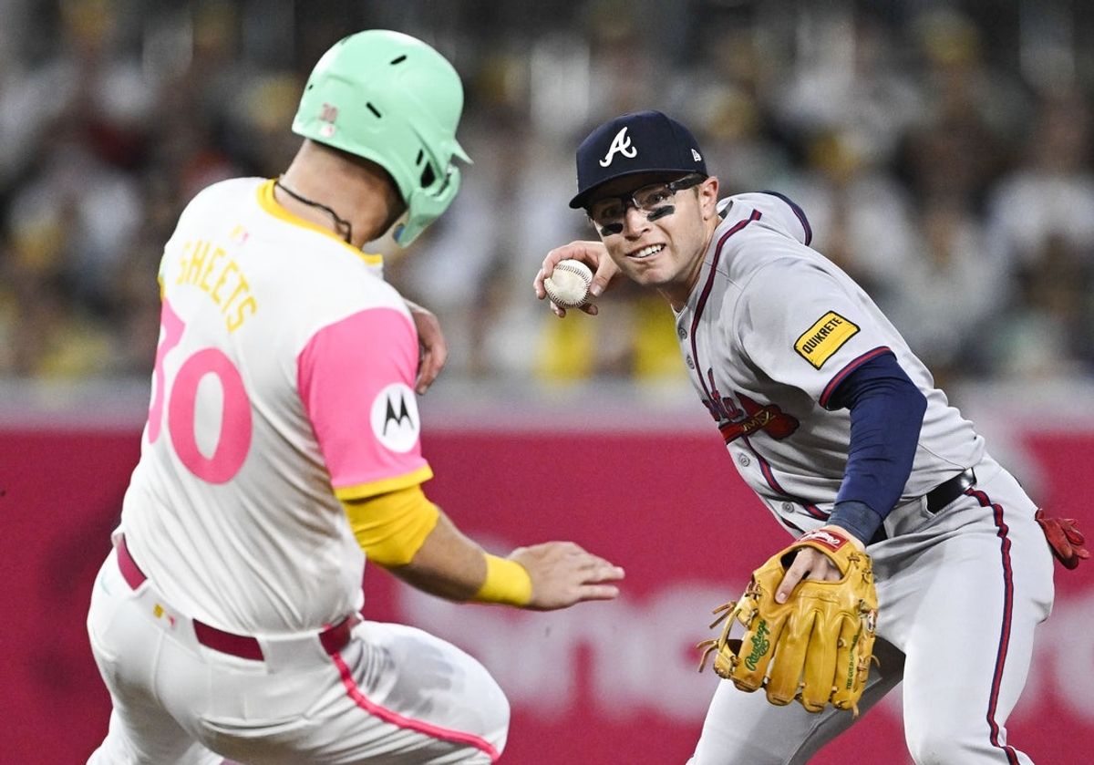Mar 28, 2025; San Diego, California, USA; Atlanta Braves shortstop Nick Allen (2) throws over San Diego Padres outfielder Gavin Sheets (30) as he tries to turn a double play during second inning at Petco Park. Mandatory Credit: Denis Poroy-Imagn Images