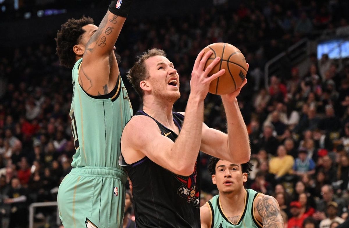 Mar 28, 2025; Toronto, Ontario, CAN;  Toronto Raptors center Jakob Poeltl (19) prepares to shoot the ball against the Charlotte Hornets in the first half at Scotiabank Arena. Mandatory Credit: Dan Hamilton-Imagn Images