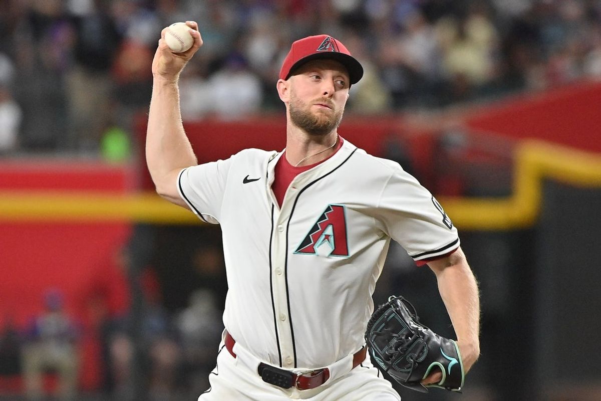Mar 28, 2025; Phoenix, Arizona, USA;  Arizona Diamondbacks pitcher Merrill Kelly (29) throws in the third inning against the Chicago Cubs at Chase Field. Mandatory Credit: Matt Kartozian-Imagn Images