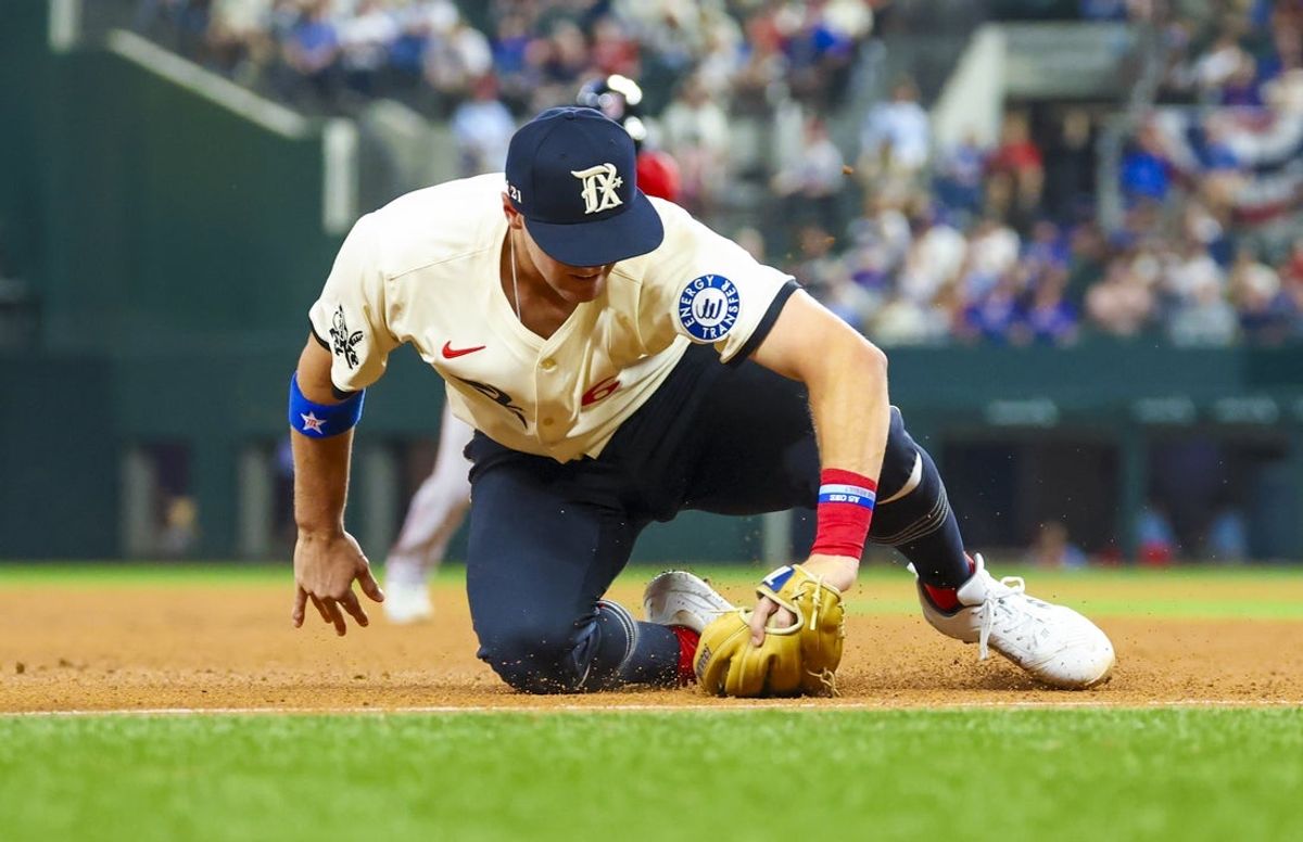 Mar 28, 2025; Arlington, Texas, USA; Texas Rangers third baseman Josh Jung (6) fields a ball during the seventh inning against the Boston Red Sox at Globe Life Field. Mandatory Credit: Kevin Jairaj-Imagn Images