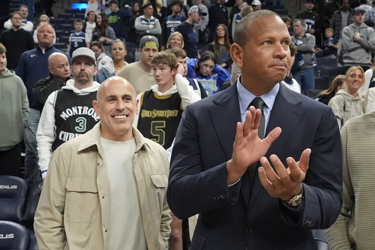 Mar 28, 2025; Minneapolis, Minnesota, USA; Minnesota Timberwolves owners Marc Lore and Alex Rodriguez celebrate the team's win over the Phoenix Suns at Target Center. Mandatory Credit: Bruce Kluckhohn-Imagn Images